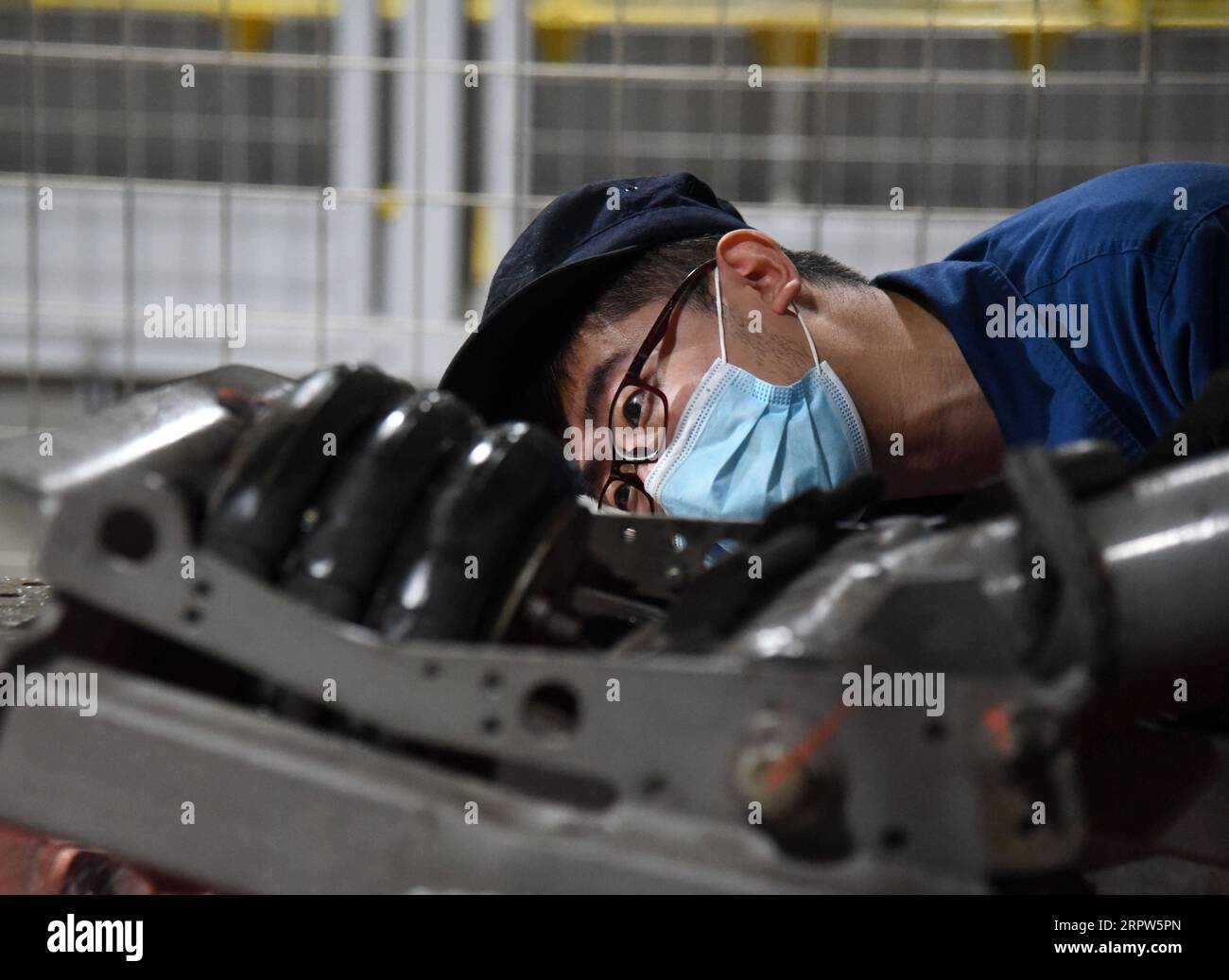 200422 LINYI, April 22, 2020 A staff member inspects a train of