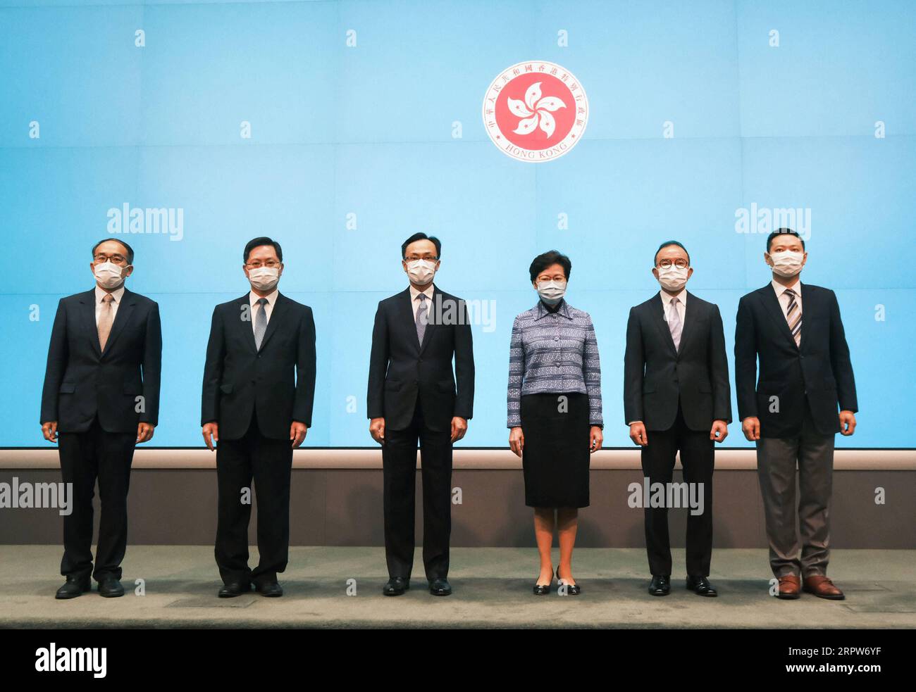 200422 -- HONG KONG, April 22, 2020 Xinhua -- Chief Executive of China s Hong Kong Special Administrative Region HKSAR Carrie Lam Cheng Yuet-ngor 3rd R attends a press conference with newly appointed Secretary for the Civil Service Nip Tak-kuen 3rd L, Secretary for Home Affairs Tsui Ying-wai 1st R, Secretary for Constitutional and Mainland Affairs Tsang Kwok-wai 2nd R, Secretary for Financial Services and the Treasury Hui Ching-yu 1st L, and Secretary for Innovation and Technology Sit Wing-hang 2nd L in Hong Kong, south China, April 22, 2020. China s State Council on Wednesday announced the ap Stock Photo