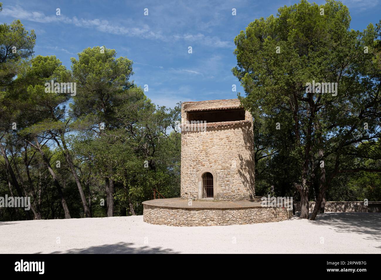 19th-century Fuveau pigeonnier: 22m stone tower, Provençal landmark. Once a windmill, now historic gem, France Stock Photo