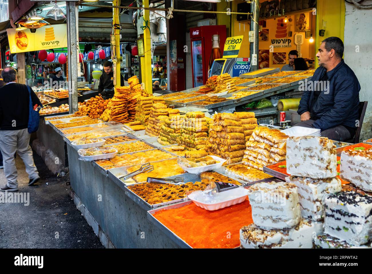 Vendor sells sweet pastries at the Carmel Market in Tel Aviv, Israel. Stock Photo