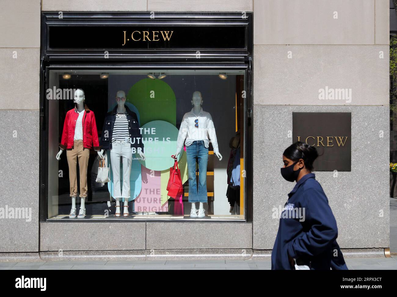 200505 -- NEW YORK, May 5, 2020 -- A pedestrian walks past a J.Crew store in Manhattan of New York, the United States, May 4, 2020. J. Crew Group, a U.S. apparel retailer which also operates the Madewell brand, has filed for bankruptcy protection, as the COVID-19 fallout continues to ripple through the nation. It has filed to begin Chapter 11 proceedings in the U.S. Bankruptcy Court for the Eastern District of Virginia, according to a statement by the company on Monday. The company said its lenders have agreed to convert approximately 1.65 billion U.S. dollars of its debt into equity.  U.S.-NE Stock Photo