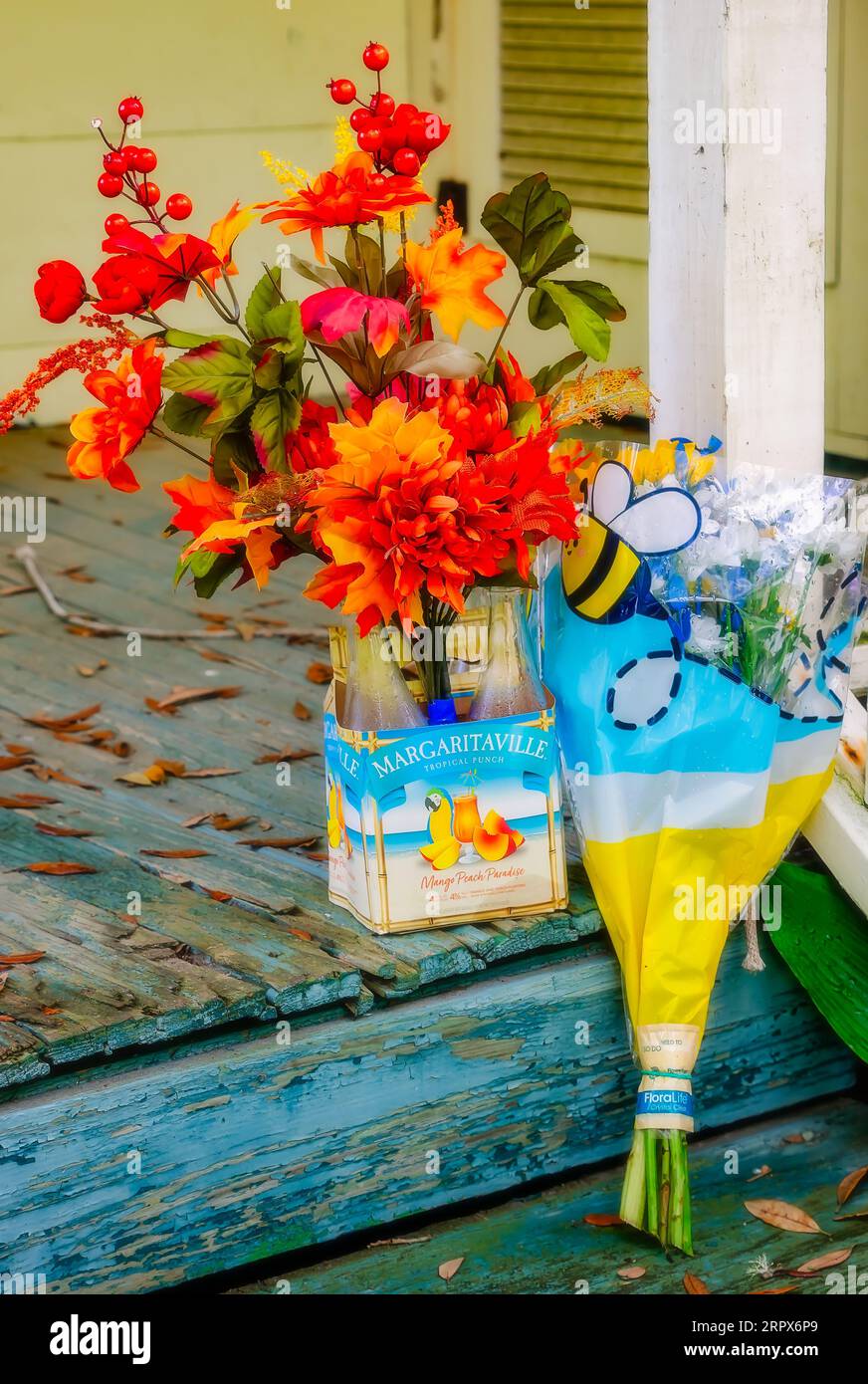 Flowers sit on the front porch of Jimmy Buffett’s childhood home, Sept. 2, 2023, in Pascagoula, Mississippi. Stock Photo