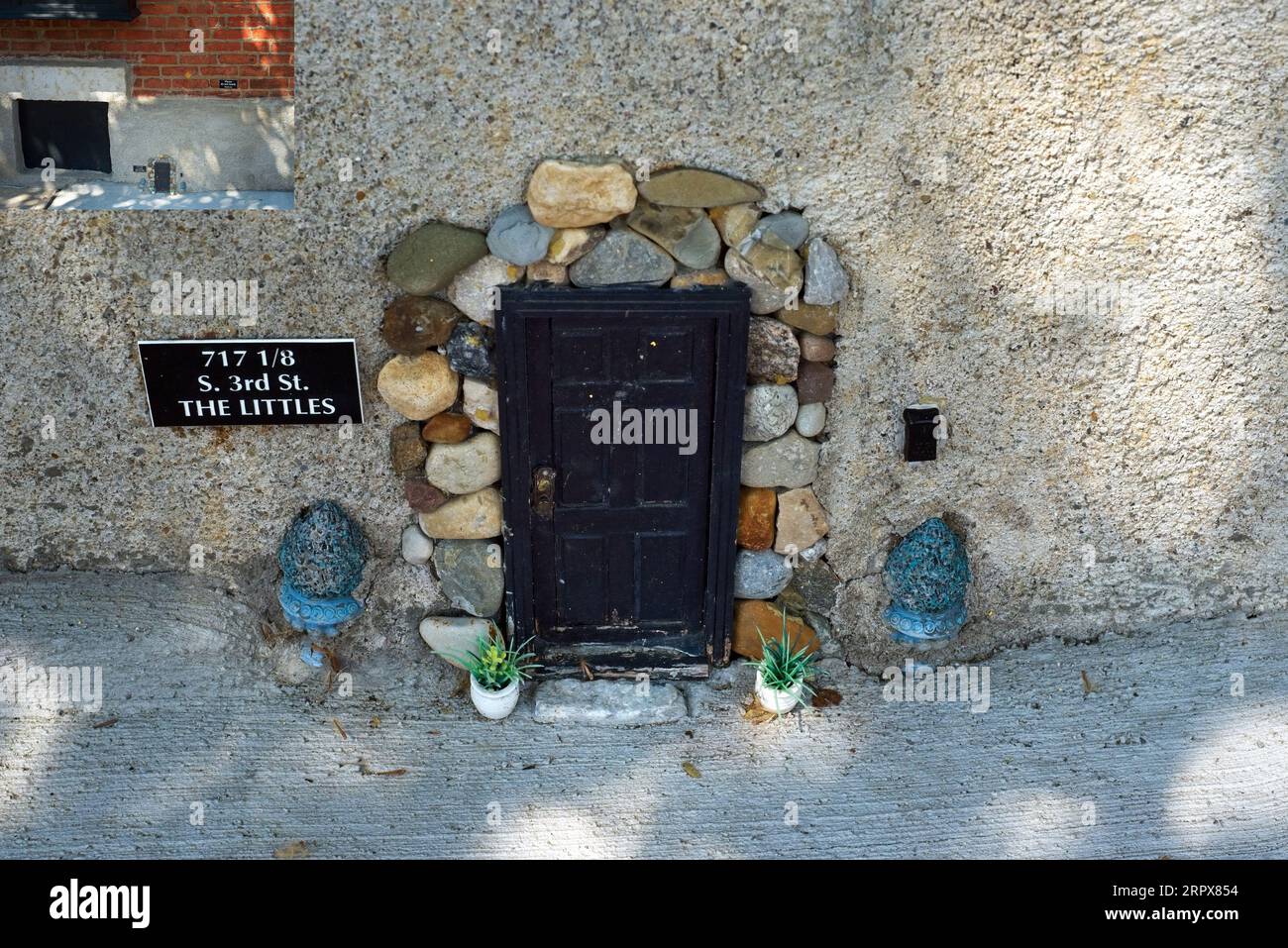A mouse-sized doorway based on the fictional character Stuart Little adds whimsy in German Village, shown with an inset for scale. Stock Photo