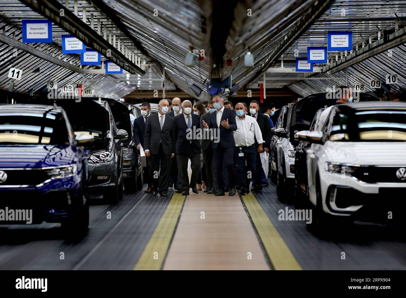 News Bilder des Tages 200514 -- LISBON, May 14, 2020 -- Portuguese President Marcelo Rebelo de Sousa 1st L, front and Portuguese Prime Minister Antonio Costa 2nd L, front visit the Volkswagen Autoeuropa car factory in Palmela, Portugal, May 13, 2020. Portuguese President Marcelo Rebelo de Sousa and Prime Minister Antonio Costa on Wednesday encouraged all industries to restart under strict conditions amid the COVID-19 pandemic, Lusa News Agency reported. After their joint visit to automotive assembly plant Autoeuropa, the two leaders expressed their confidence in the resumption of production fo Stock Photo