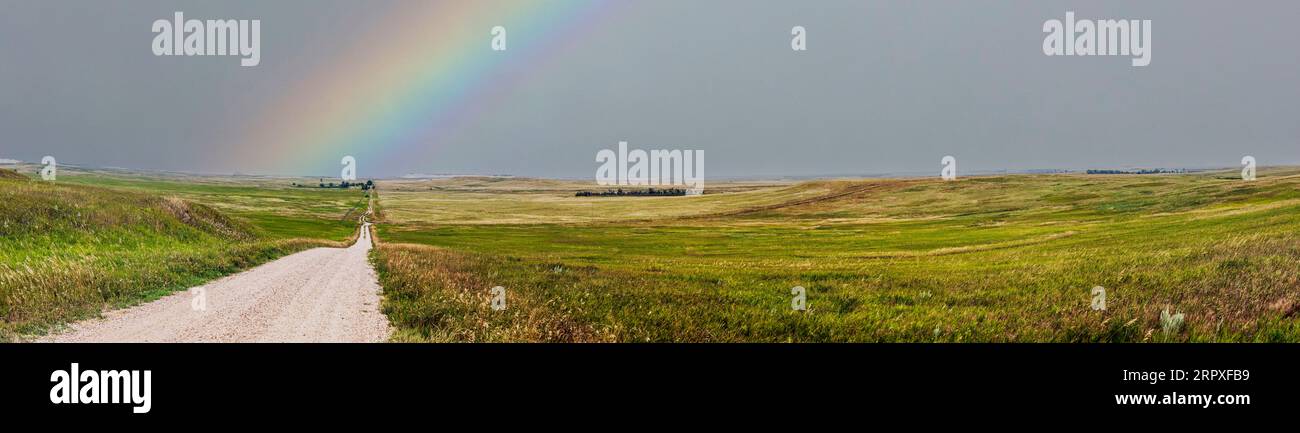 Panorama view; rural dirt road; Badlands National Park; South Dakota; USA Stock Photo