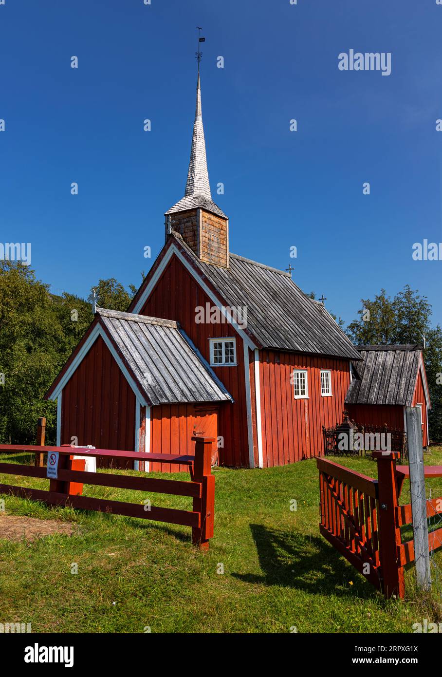 The pretty, red, rural church of Gløshaug in the municipality of Grong, is an active church and part of Norwegian cultural heritage. Stock Photo