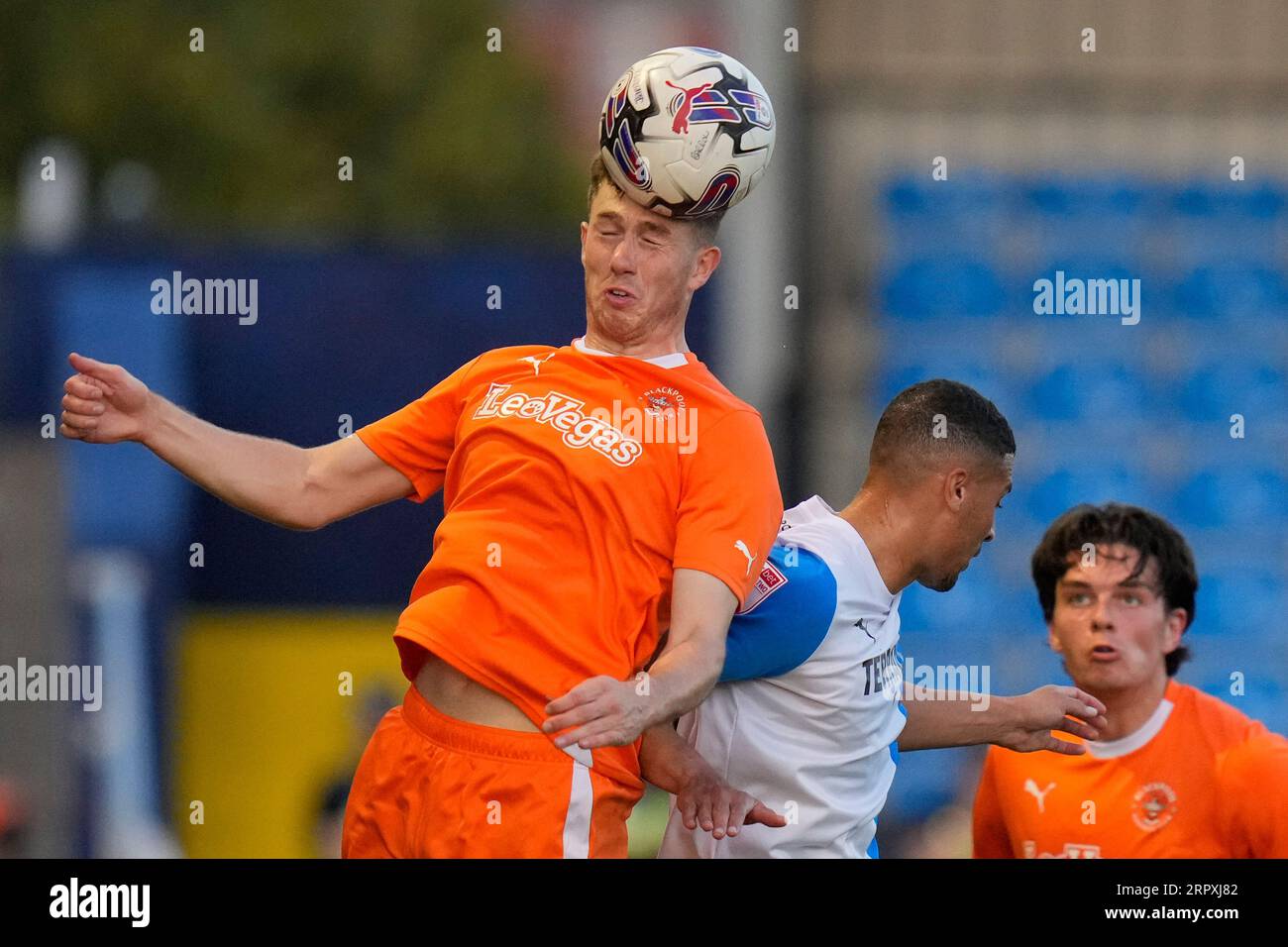 Jensen Weir 15 of Blackpool wins a header during the EFL Trophy match