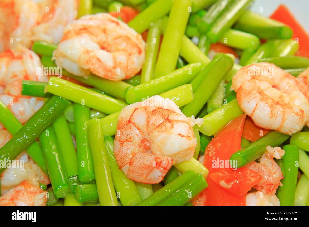 Chinese style dishes garlic stem fried shrimp, closeup of photo Stock