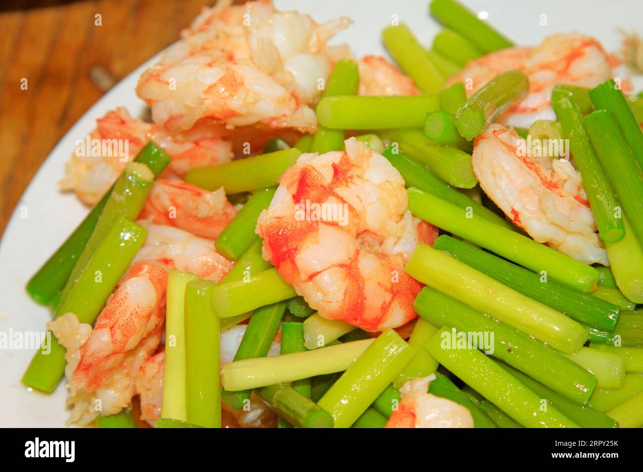 Chinese style dishes garlic stem fried shrimp, closeup of photo Stock