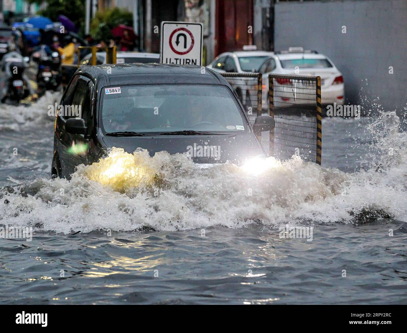 200611 -- MANILA, June 11, 2020 -- A car drives through a flooded area caused by the heavy rain from the tropical depression locally named Butchoy in Manila, the Philippines, on June 11, 2020.  PHILIPPINES-MANILA-TROPICAL DEPRESSION BUTCHOY ROUELLExUMALI PUBLICATIONxNOTxINxCHN Stock Photo