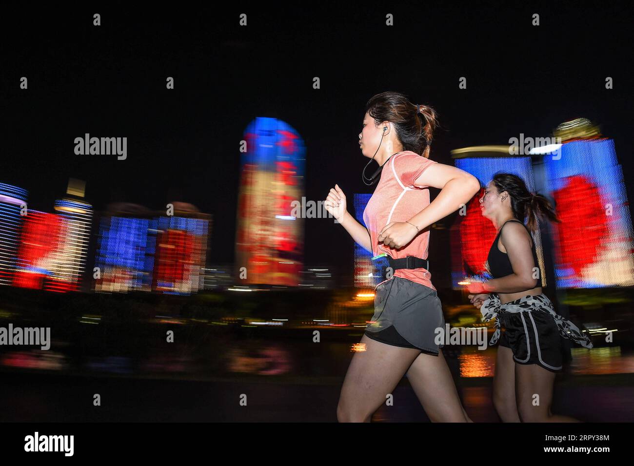 200612 -- HAIKOU, June 12, 2020 -- Citizens run in Wanlu Park in Haikou, south China s Hainan Province, May 15, 2020. Night run has become a popular sport among citizens in Haikou.  SPCHINA-HAIKOU-LIFESTYLE-NIGHT RUN PuxXiaoxu PUBLICATIONxNOTxINxCHN Stock Photo