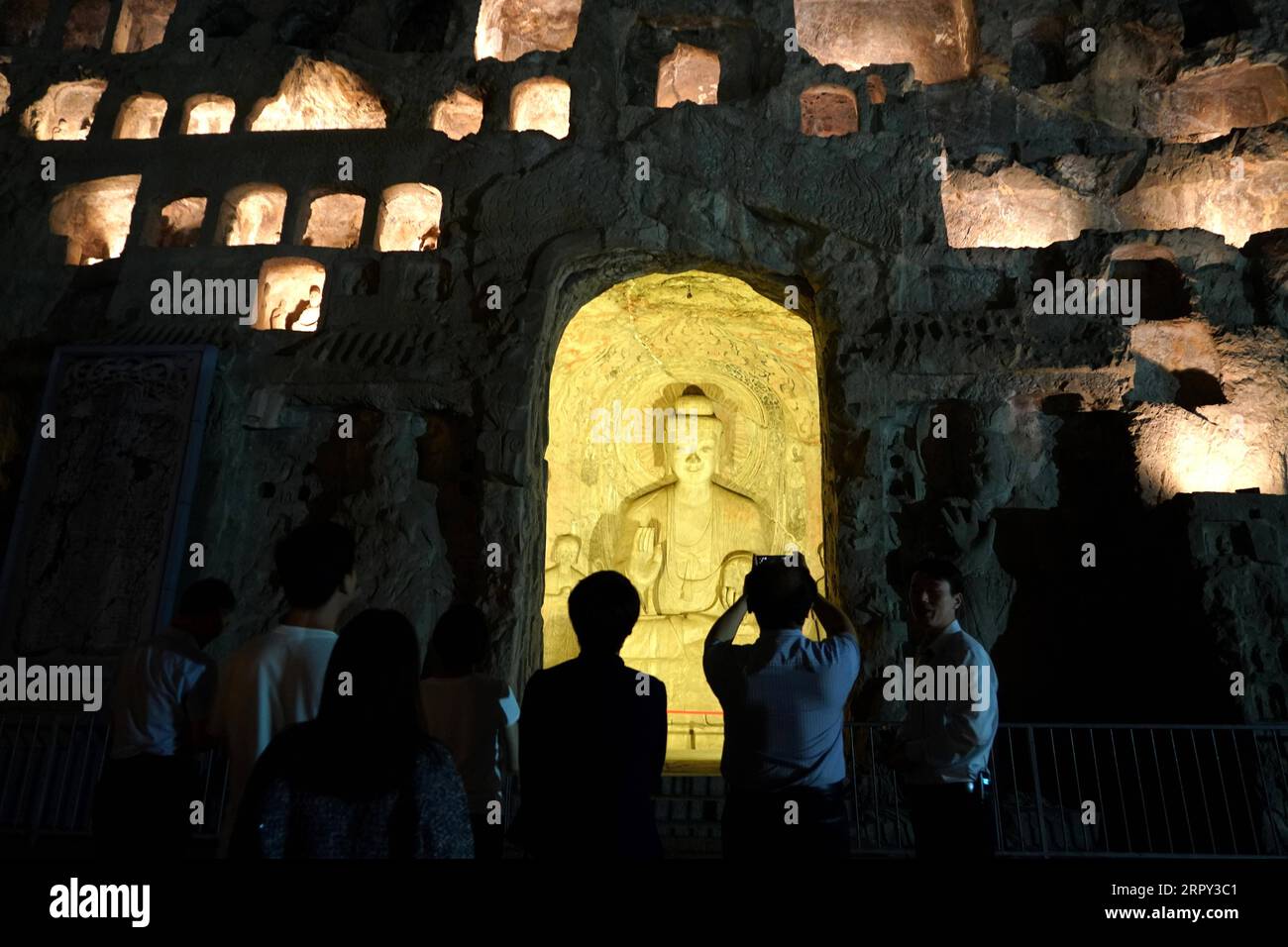 200612 -- BEIJING, June 12, 2020 -- Tourists take part in a night tour at the Longmen Grottoes scenic area in Luoyang, central China s Henan Province, June 8, 2020.  Xinhua Headlines: Night markets inject new impetus for China s recovering economy LixAn PUBLICATIONxNOTxINxCHN Stock Photo