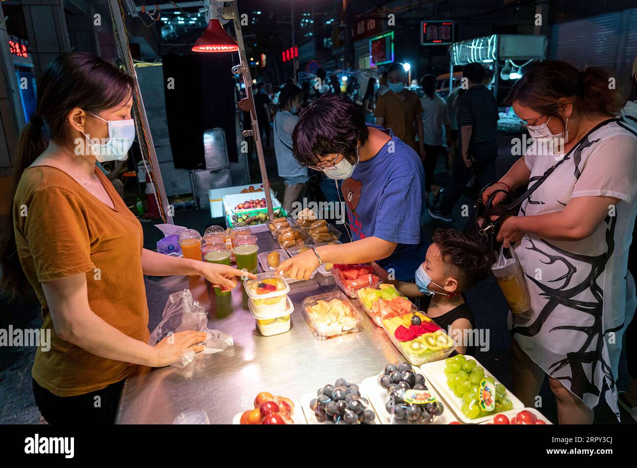 200612 -- BEIJING, June 12, 2020 -- People visit a night market in Baocheng Road in Wuhan, central China s Hubei Province, June 1, 2020.  Xinhua Headlines: Night markets inject new impetus for China s recovering economy XiongxQi PUBLICATIONxNOTxINxCHN Stock Photo