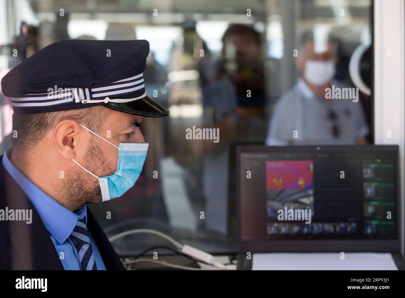 200612 -- ATHENS, June 12, 2020 -- A staff member monitors the screen of the thermal camera at a train station in Athens, Greece, on June 12, 2020.  GREECE-ATHENS-COVID-19-TRAIN STATION MariosxLolos PUBLICATIONxNOTxINxCHN Stock Photo