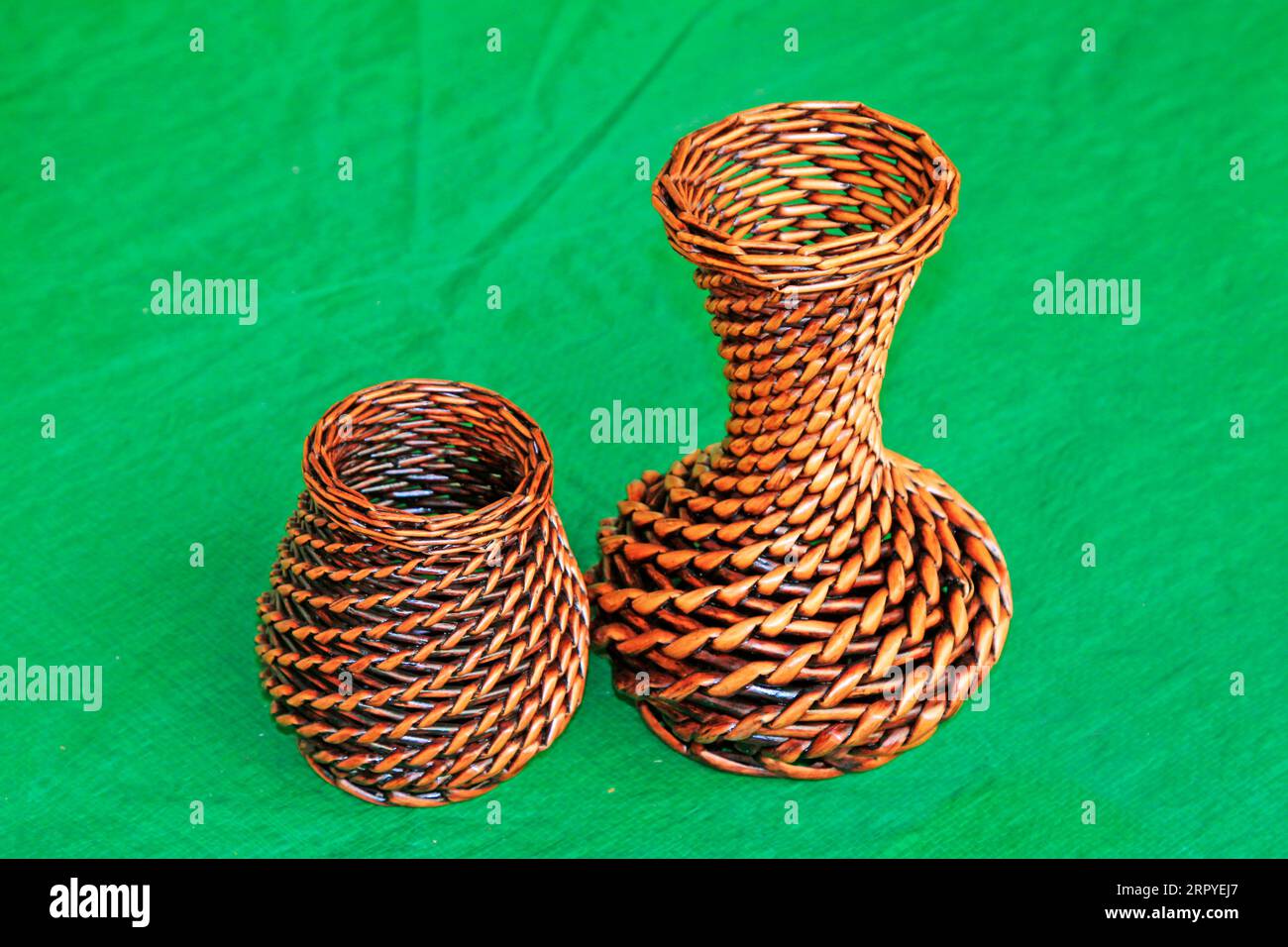 rattan weaving objects on green background Stock Photo