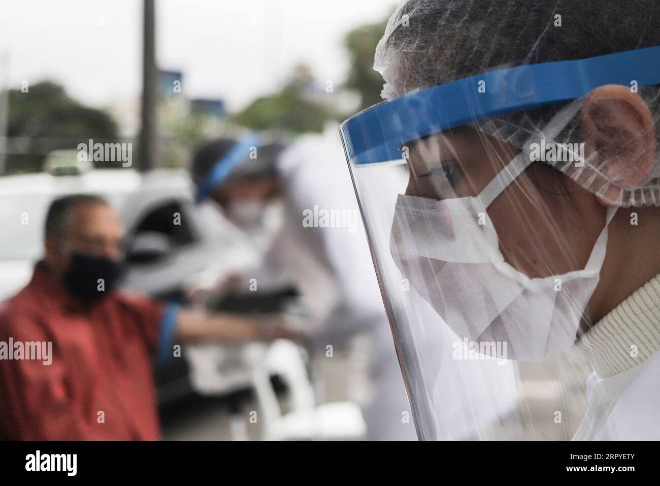 200628 -- BEIJING, June 28, 2020 -- Medical workers in personal protective equipment are on duty to perform COVID-19 rapid tests for taxi drivers in Sao Paolo, Brazil, June 26, 2020.  XINHUA PHOTOS OF THE DAY RahelxPatrasso PUBLICATIONxNOTxINxCHN Stock Photo