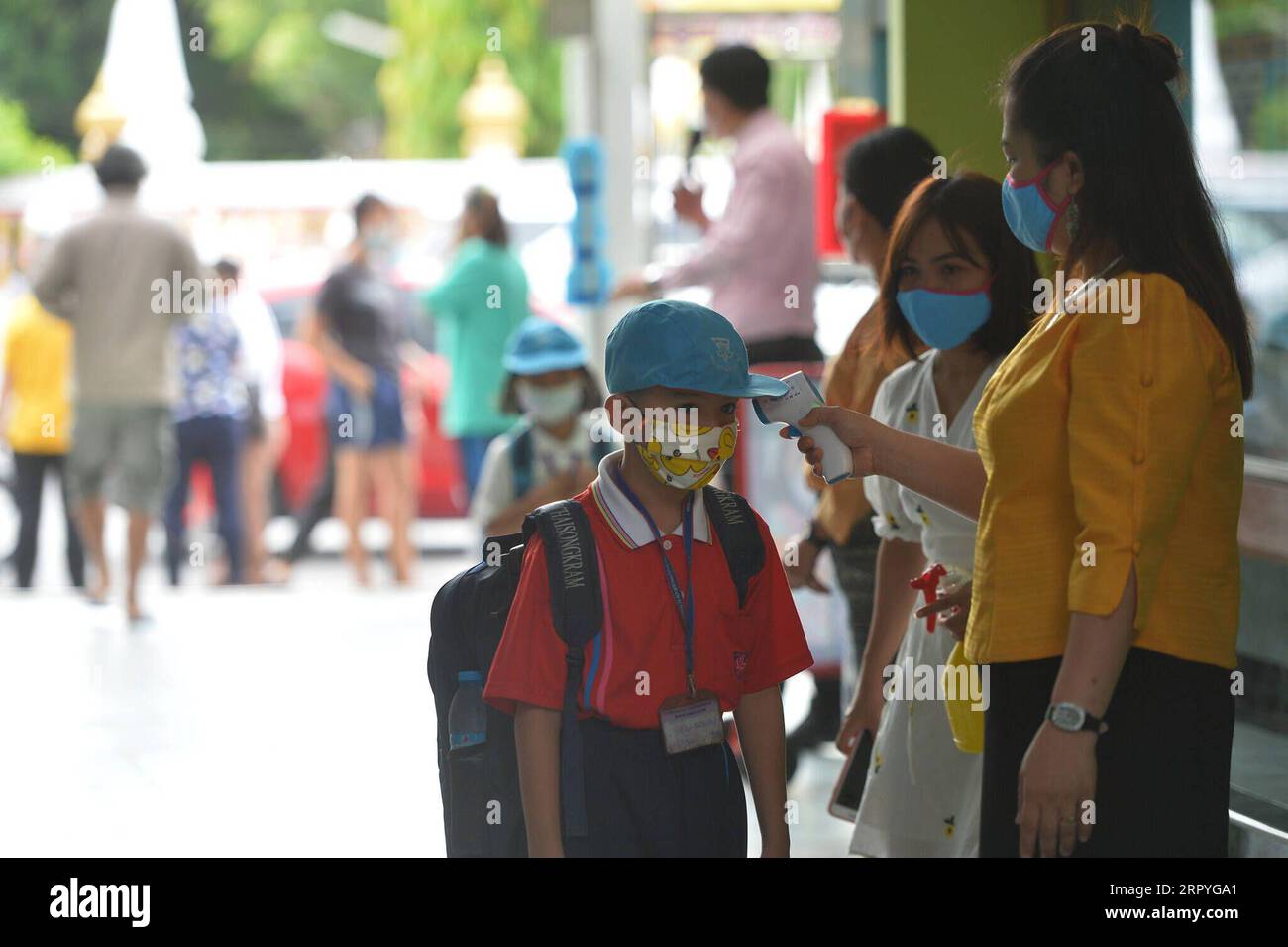 200701 -- BANGKOK, July 1, 2020 Xinhua -- A student has his temperature checked at the entrance of a school in Bangkok, Thailand, July 1, 2020. Schools in Thailand reopened on Wednesday. Xinhua/Rachen Sageamsak THAILAND-BANGKOK-COVID-19-SCHOOL-REOPENING PUBLICATIONxNOTxINxCHN Stock Photo