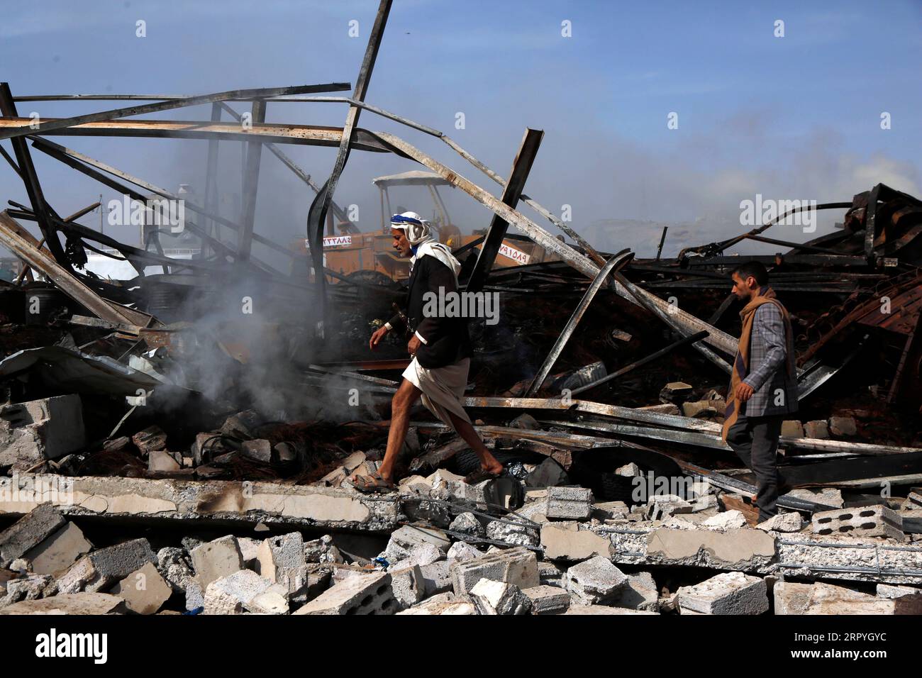 Rubble Running 200702 -- SANAA, July 2, 2020 Xinhua -- Yemeni people walk on the ...