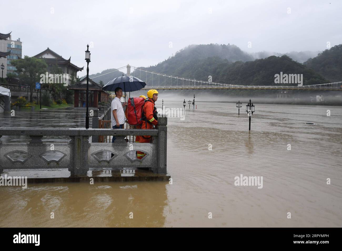 200709 -- TONGLU, July 9, 2020 -- Rescuers are on duty near a flooded dock in Tonglu County, east China s Zhejiang Province July 8, 2020. Some areas in Tonglu have been inundated since the Xin an River Reservoir, an important flood control project in the upper reaches of the Qiantang River, started discharging floodwater on Tuesday due to heavy downpours. A total of 27,397 residents in the county have been evacuated.  CHINA-ZHEJIANG-FLOOD DISCHARGE-EVACUATION CN HuangxZongzhi PUBLICATIONxNOTxINxCHN Stock Photo