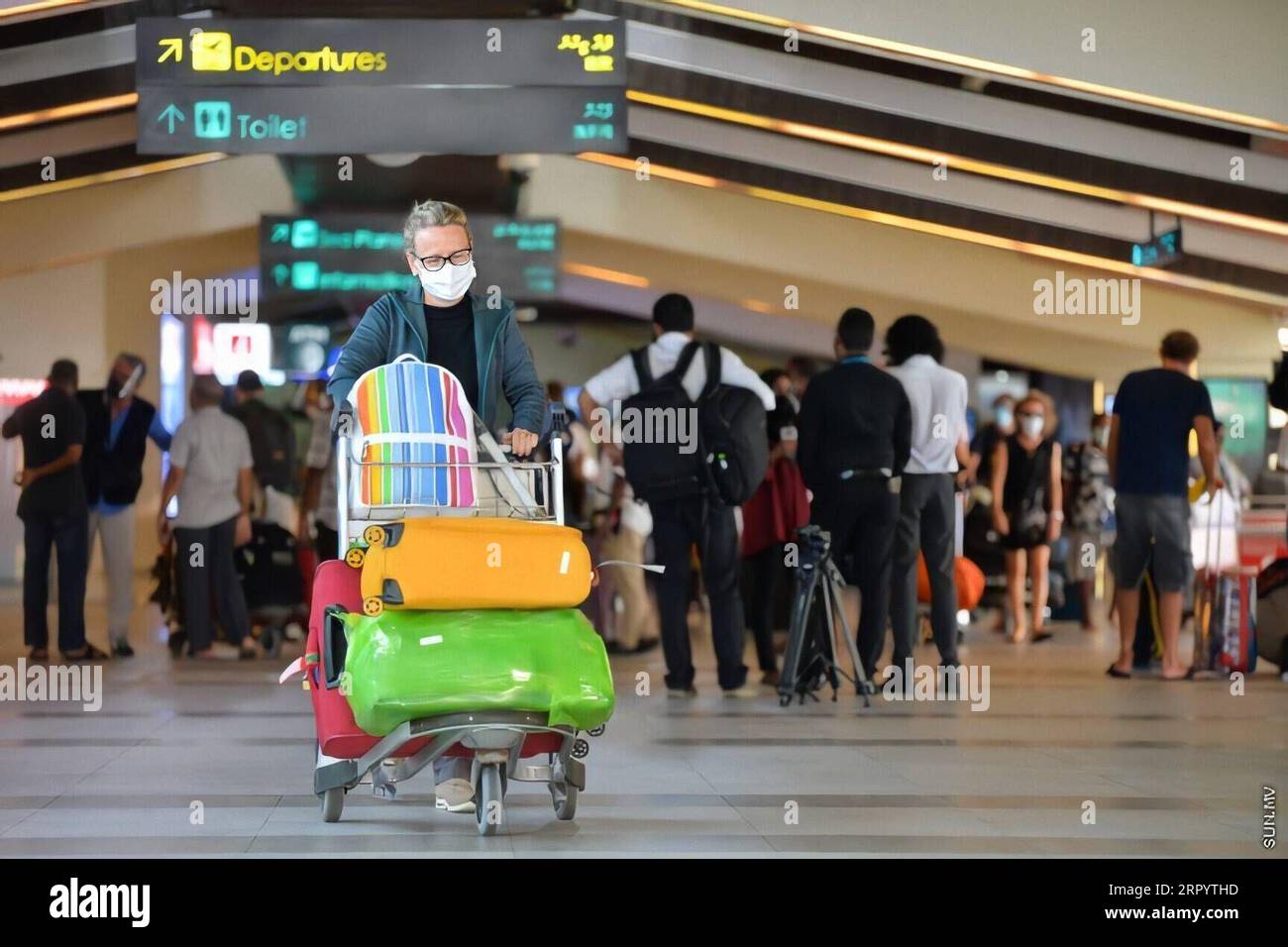 200715 -- MALE, July 15, 2020  -- A passenger pushes a luggage cart after getting off the first flight into the country in months at the Velana International Airport in Male, the Maldives, July 15, 2020. A Qatar Airways flight carrying 107 foreigners and 27 Maldivians arrived at the Velana International Airport in the Maldives on Wednesday morning, marking the first arrival of tourists since the country closed its borders on March 27 amid the COVID-19 pandemic.  MALDIVES-MALE-TOURISTS-ARRIVAL Xinhua PUBLICATIONxNOTxINxCHN Stock Photo