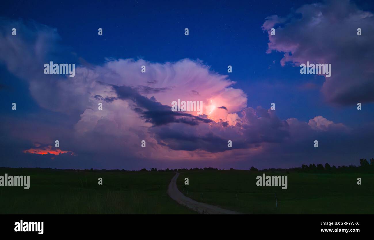 Thunderstorm at night with Milky way moving across the sky Stock Photo ...
