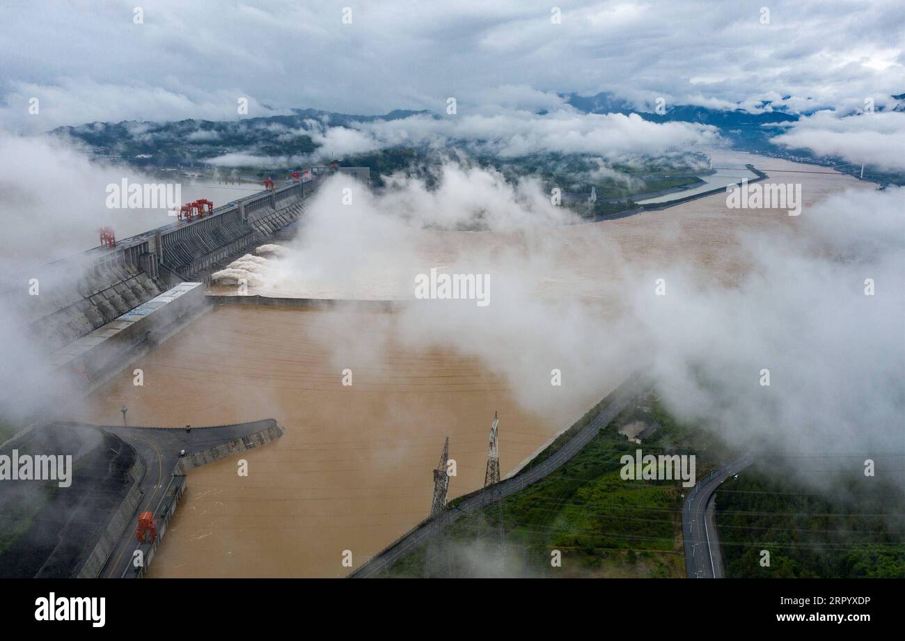 200718 -- YICHANG, July 18, 2020 -- Aerial photo taken on July 18, 2020 shows the Three Gorges Dam opening the floodgates to discharge the floodwater on the Yangtze River in central China s Hubei Province. The Three Gorges reservoir in central China s Hubei Province has seen the second flood along the Yangtze River in 2020, the largest one arriving at the reservoir so far this year. At 8 a.m. on Saturday, the inbound flow of water reached 61,000 cubic meters per second while the outbound flow was 33,000 cubic meters per second, with 45 percent of floodwater withheld in the reservoir, according Stock Photo