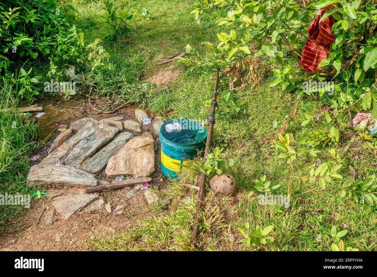 Some rural Filipinos have no running water so they cut into municipal pipes, using the water for