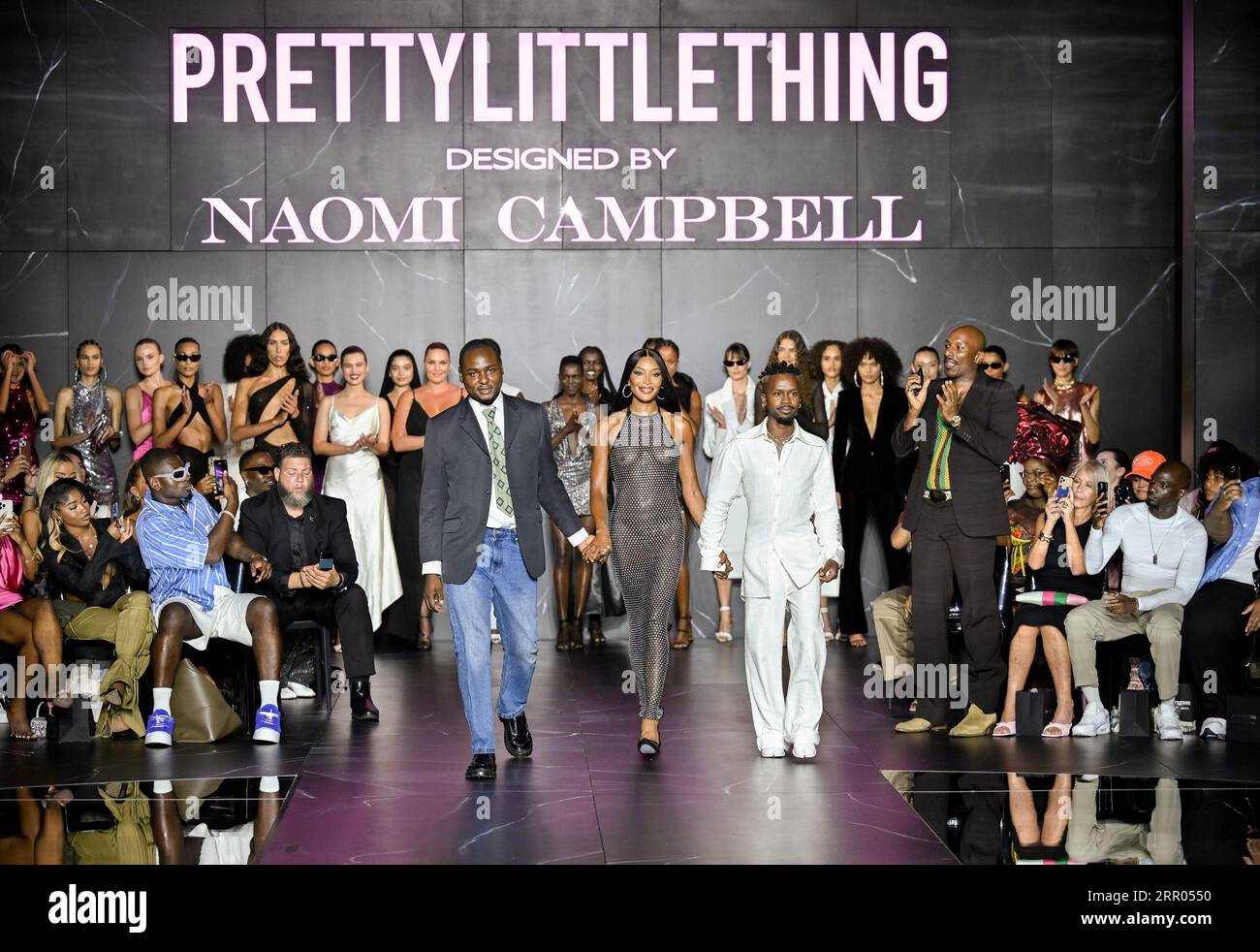 EDS NOTE: NUDITY - Designers Victor Anate, left, Naomi Campbell and