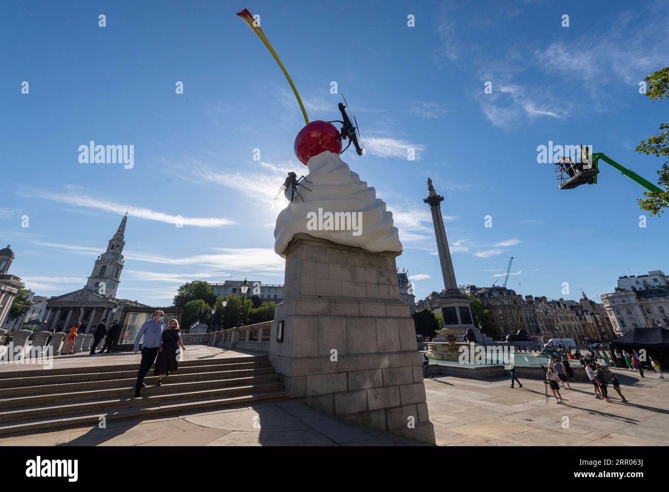 200730 -- LONDON, July 30, 2020 Xinhua -- Photo taken on July 30, 2020 shows the Fourth Plinth sculpture titled The End at Trafalgar Square in London, Britain. A new artwork by artist Heather Phillipson was unveiled Thursday on the Fourth Plinth in London s Trafalgar Square. Entitled THE END, the sculpture tops the Fourth Plinth with a giant swirl of whipped cream, a cherry, a fly and a drone that transmits a live feed of Trafalgar Square. Photo by Ray Tang/Xinhua BRITAIN-LONDON-FOURTH PLINTH SCULPTURE-UNVEILING PUBLICATIONxNOTxINxCHN Stock Photo