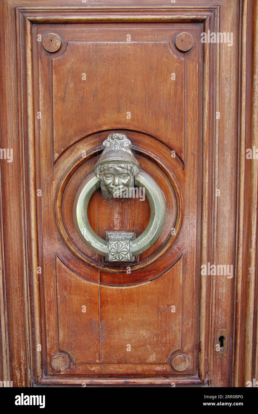 The picture was taken in Spain, Reus. The picture shows the door handle cleverly made of copper. Stock Photo