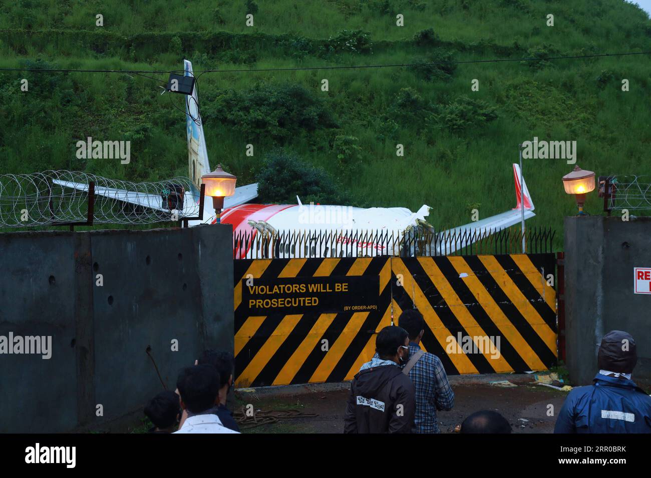 200808 -- KERALA, Aug. 8, 2020 Xinhua -- Photo taken on Aug. 8, 2020 shows debris of the Air India Express flight that skidded off a runway while landing at Kozhikode Airport in the Indian state of Kerela. The death toll in Friday evening s plane crash in south India has risen to 18, including the two pilots, as two investigating teams have reached the site to find out the exact reason of the mishap. Str/Xinhua INDIA-KERALA-KOZHIKODE AIRPORT-PLANE CRASH PUBLICATIONxNOTxINxCHN Stock Photo