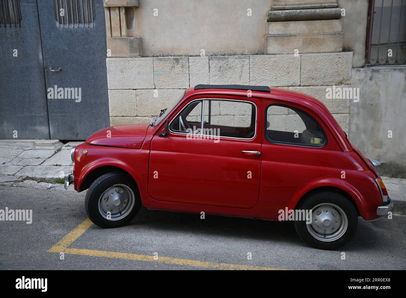 Vintage bright red Fiat 500 on the streets of Ragusa Ibla in Sicily ...