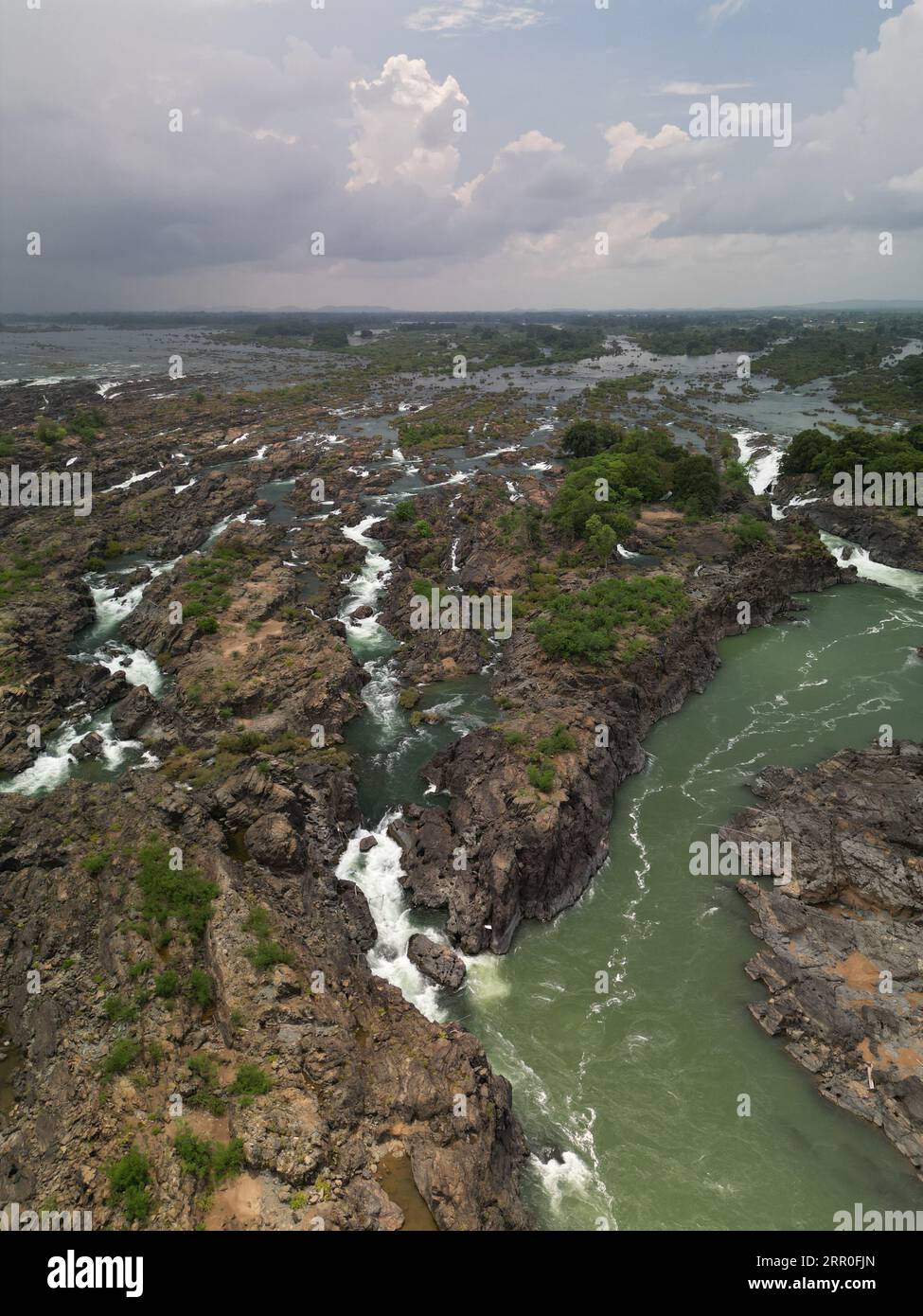 Aerial view of a majestic waterfall cascading through a picturesque ...