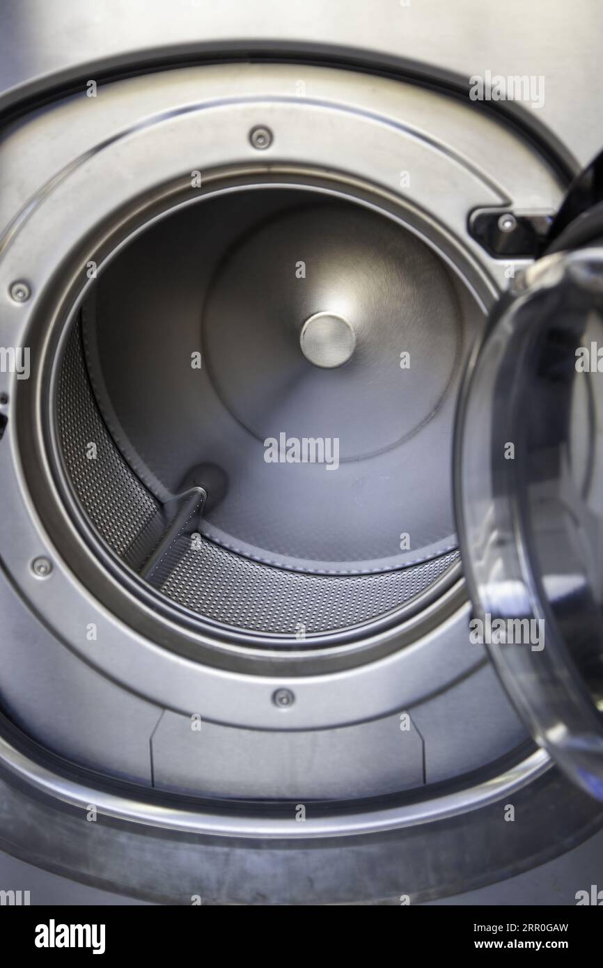 Detail of industrial washing machines, cleaning and care of clothes Stock Photo