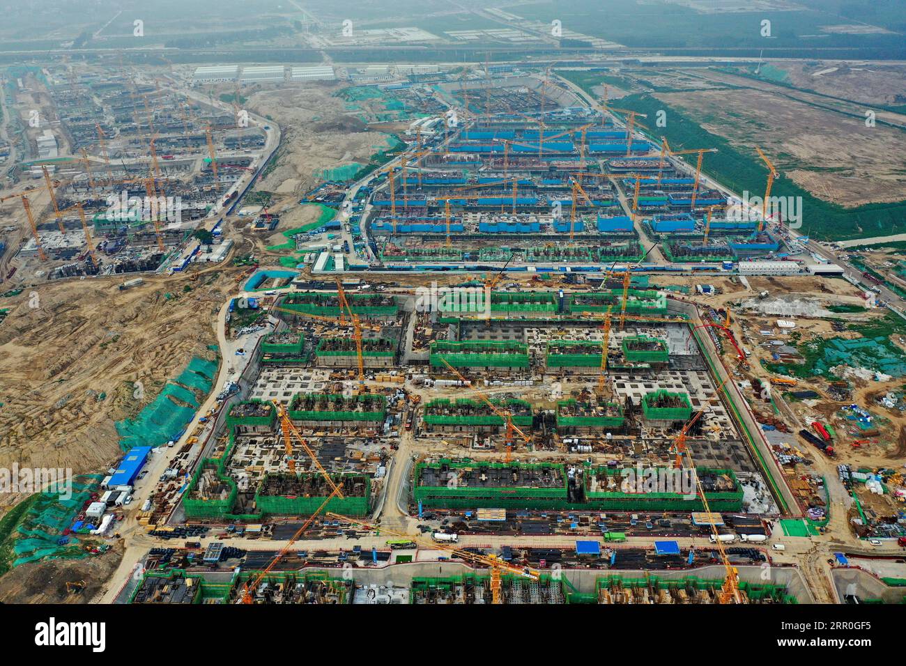 200814 -- XIONGAN, Aug. 14, 2020 Xinhua -- Aerial photo taken on Aug. 11, 2020 shows the construction site of Rongdong area, a 13-sq-km residential area that is expected to be home to 170,000 people, in Xiongan New Area, north China s Hebei Province. By the end of July, the construction work of major structures or ancillary facilities of around 70 projects planned in 2020 have started in Xiongan New Area, according to the area s management committee. Xinhua/Mu Yu CHINA-HEBEI-XIONGAN NEW AREA-CONSTRUCTION CN PUBLICATIONxNOTxINxCHN Stock Photo