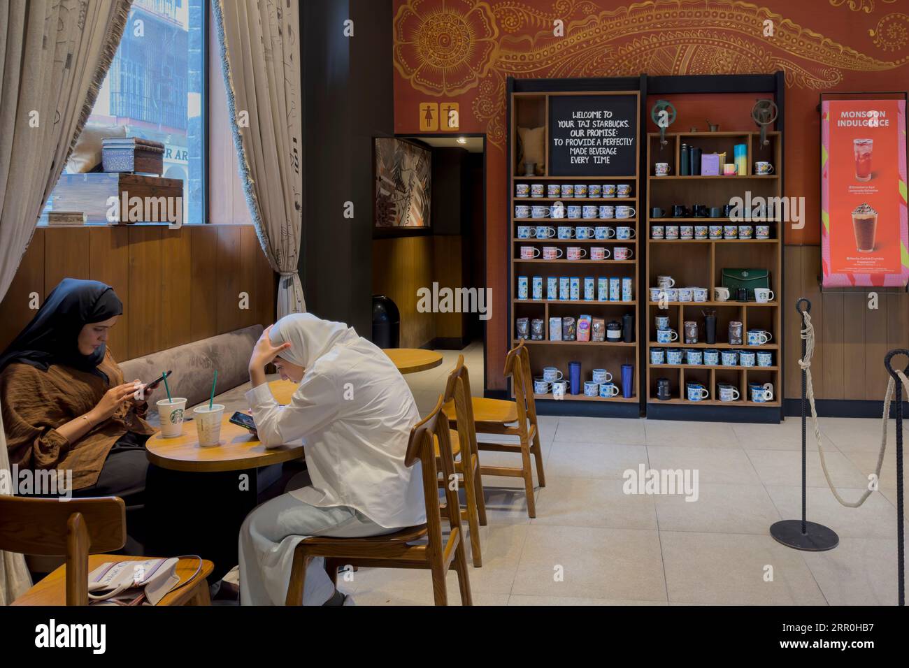 Customers sit in Starbucks cafe in Mumbai India Stock Photo Alamy