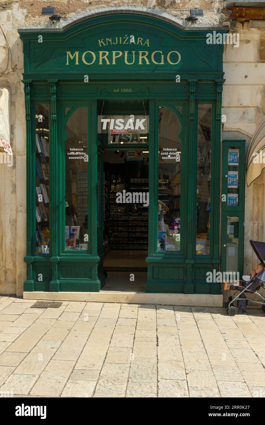 Croatia Split city port old town Morpurgo est 1860 part Tisak booth chain  leading retail outlet shop for printed matter tobacco souvenirs buggy baby  Stock Photo