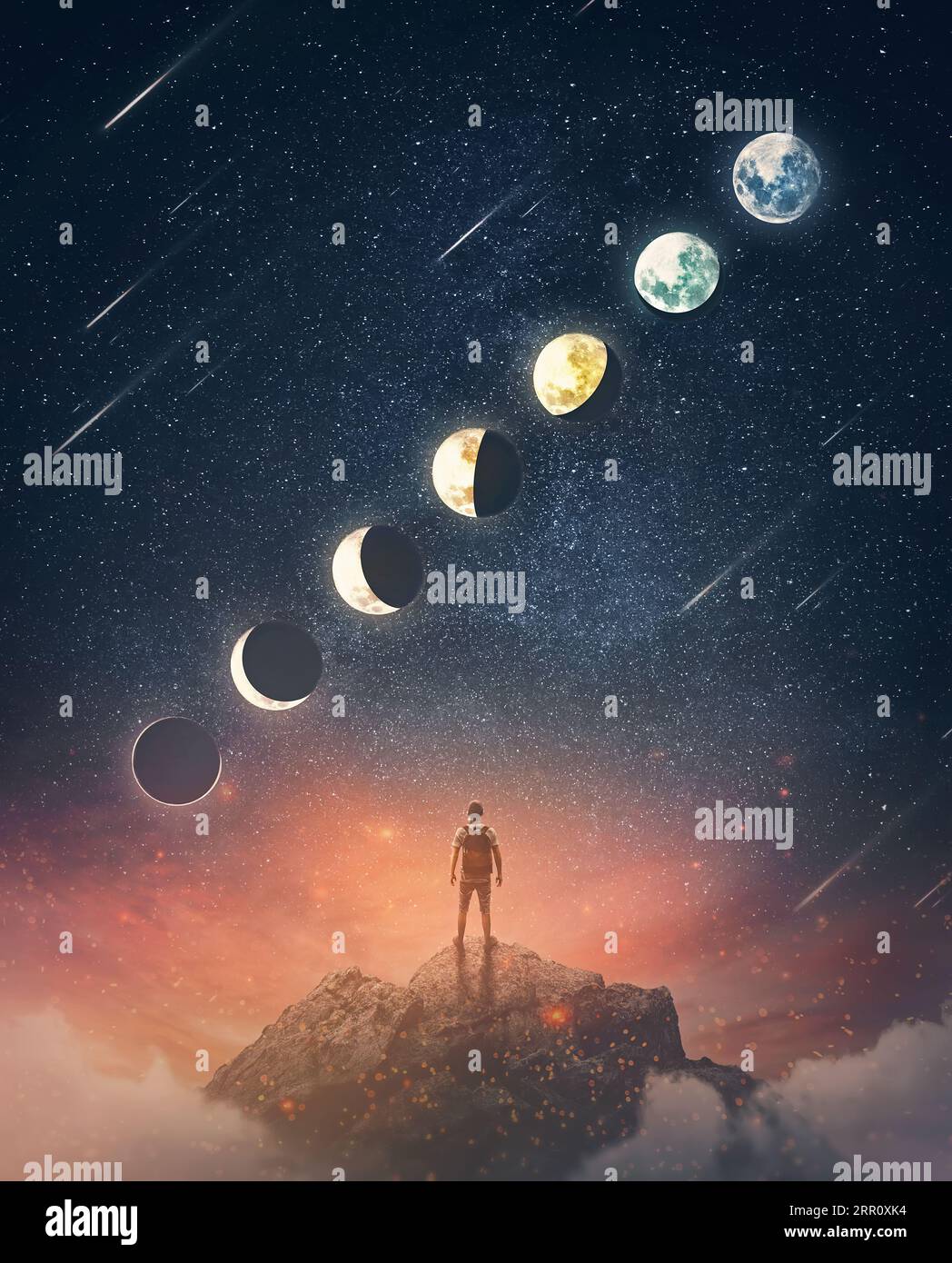 Wonderful scene with a person on the top of a mountain watching the moon phases on the starry night sky. Astronomy and astrology conceptual scene. Lun Stock Photo