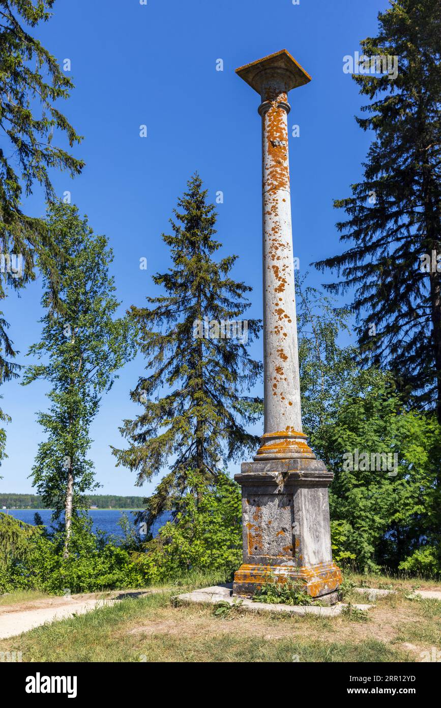 The column of two emperors is a greenish-gray marble column, installed in 1804 on an island in the eastern part of the Vyborg Monrepos park Stock Photo