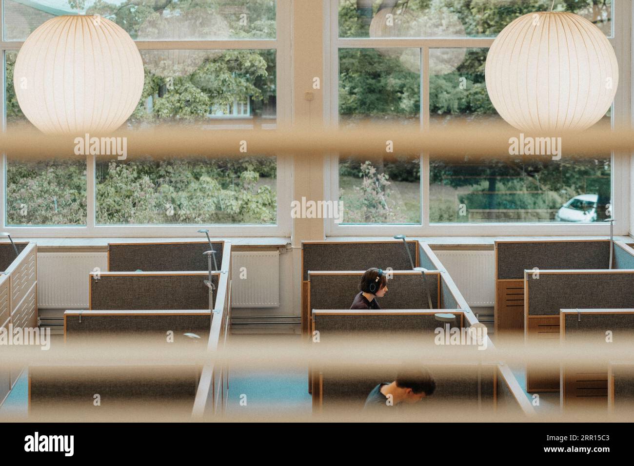 High angle view of male and female students studying in library at university Stock Photo