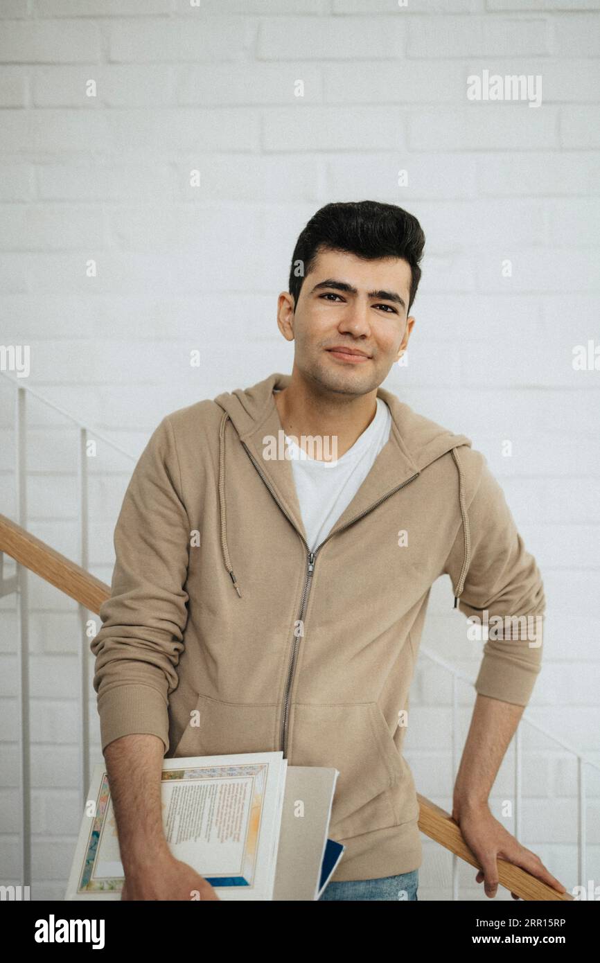 Male student standing hi-res stock photography and images - Alamy