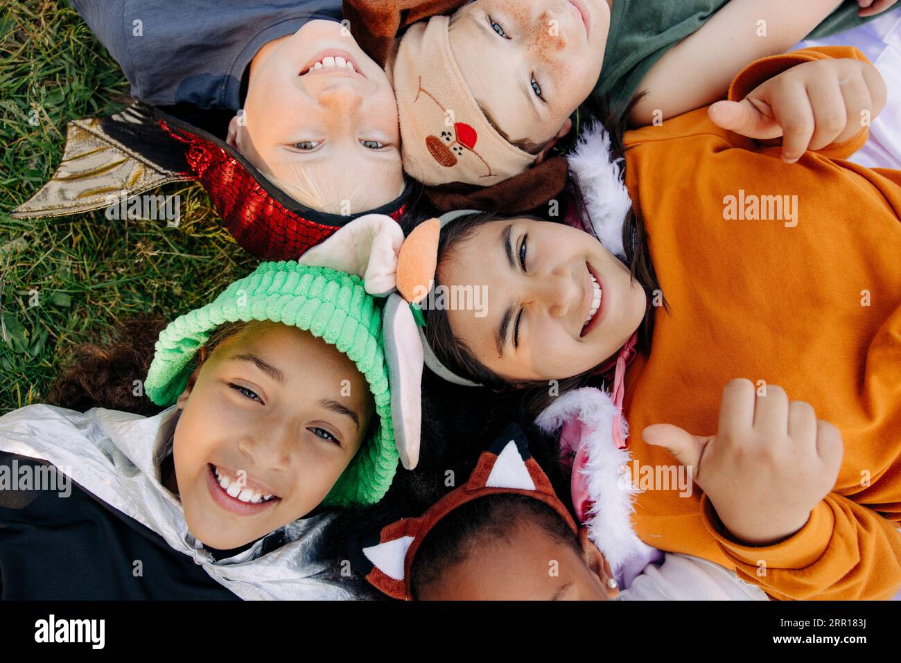 Group happy children lying on hi-res stock photography and images - Alamy