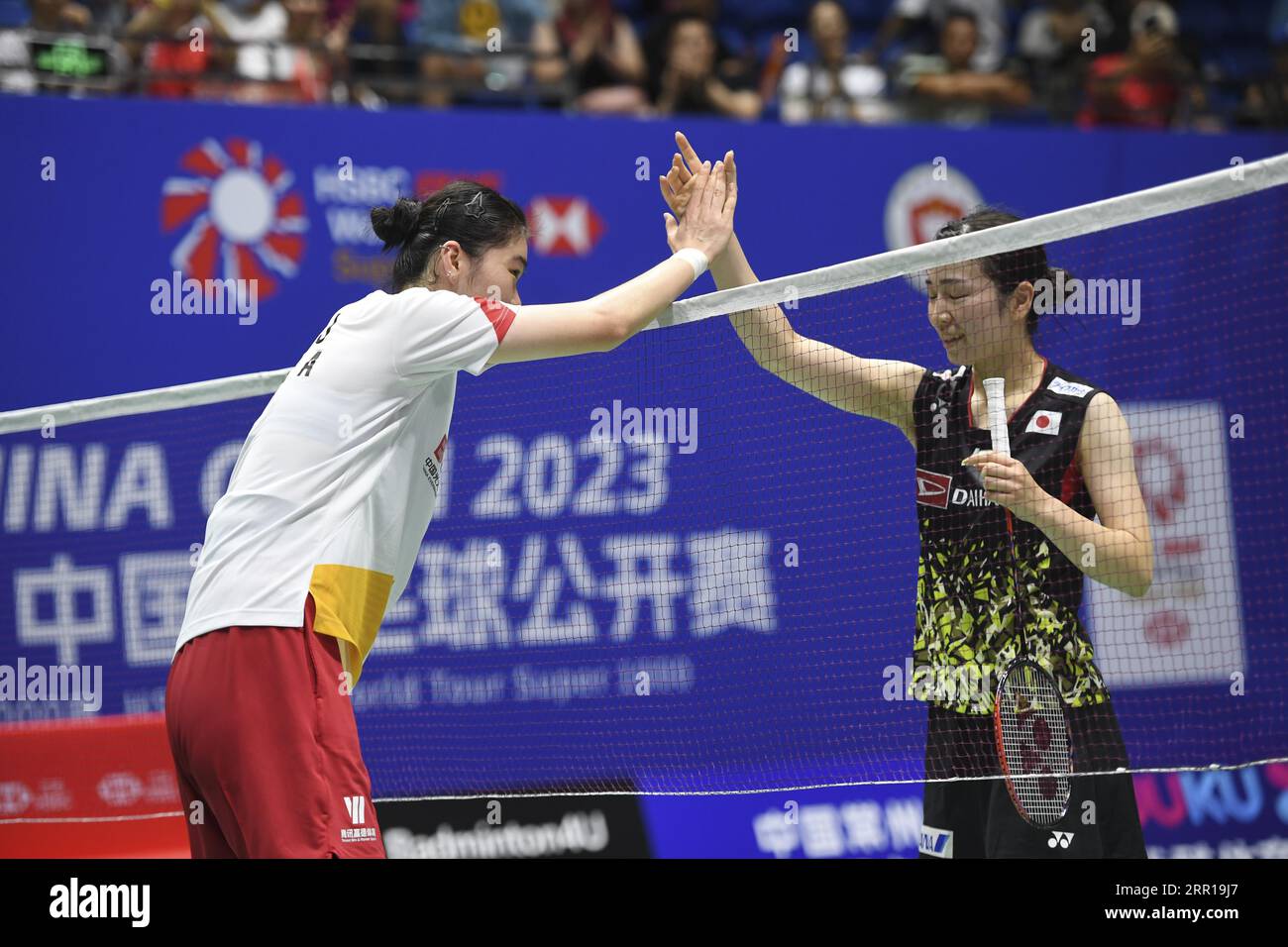 Chinese badminton player Gao Fangjie defeats Japanese badminton player