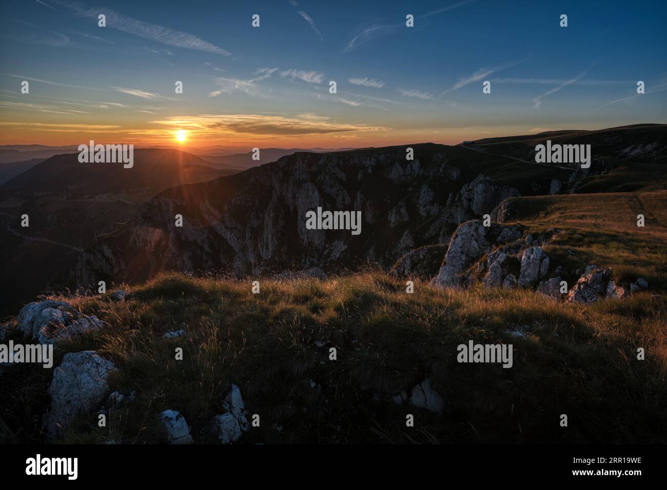 An aerial view of green hills at sunset Stock Photo - Alamy