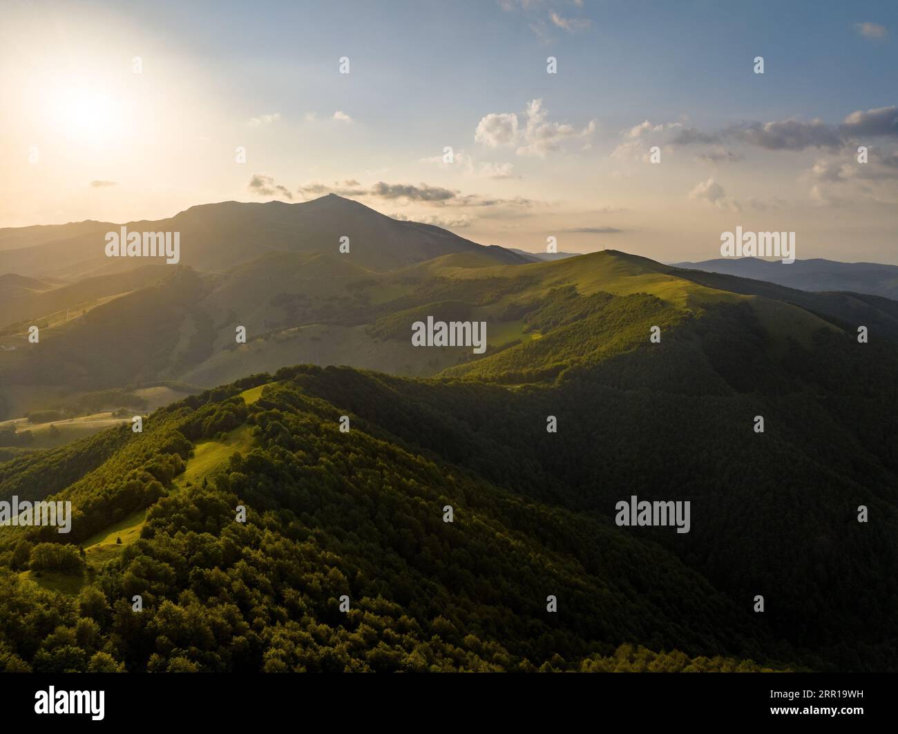 An aerial view of green hills at sunset Stock Photo - Alamy