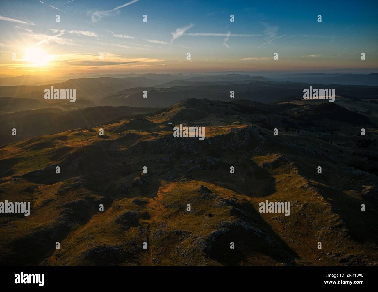 An aerial view of green hills at sunset Stock Photo - Alamy