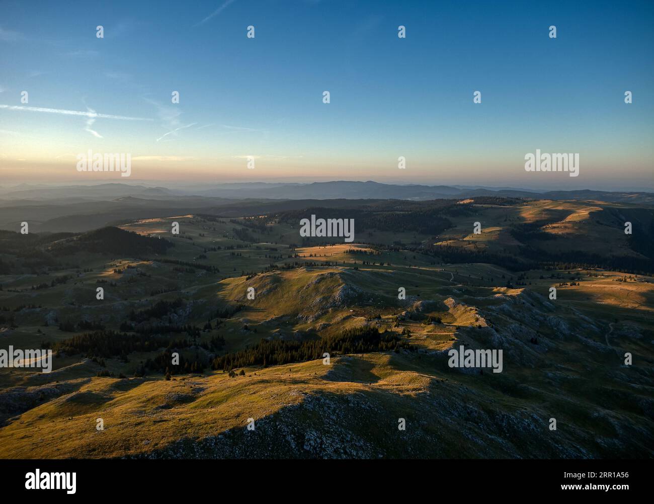 An aerial view of green hills at sunset Stock Photo - Alamy