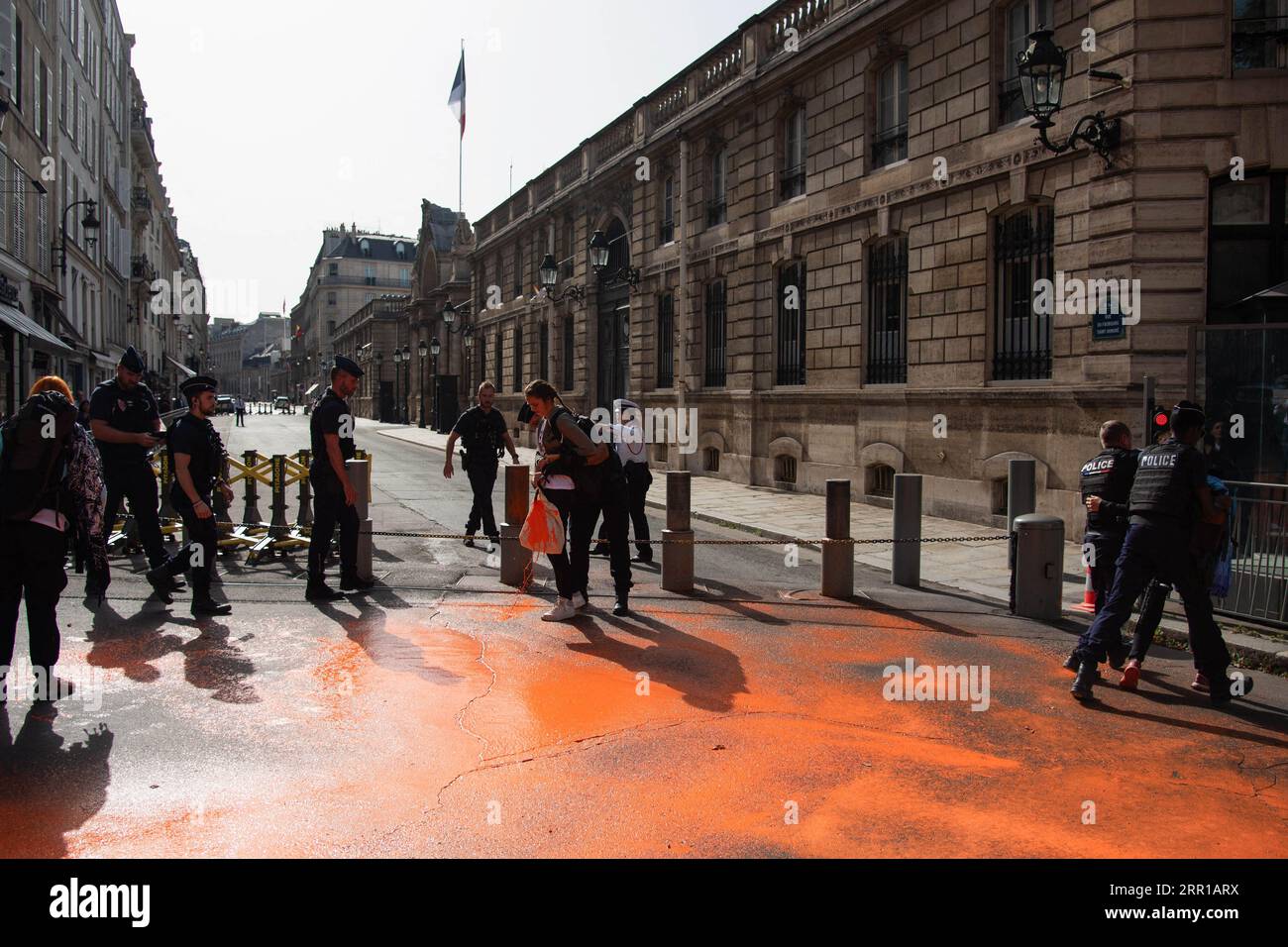 Paris, France. 06th Sep, 2023. Climate activists of 'Derniere Renovation' sprays orange paint Place Beauvau, in between the presidential Elysee Palace and the French Interior ministry, in Paris, France on September 6, 2023. Photo by Florian Poitout/ABACAPRESS.COM Credit: Abaca Press/Alamy Live News Stock Photo
