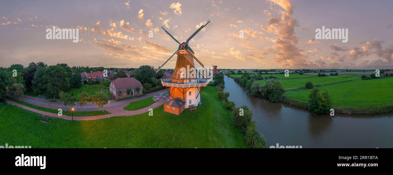 Aerial view of twin mills at Alte Greetsieler Sieltief, Greetsiel, Lower Saxony, Germany, Europe Stock Photo
