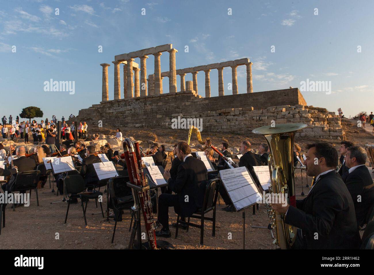 200917 -- ATHENS, Sept. 17, 2020 -- Musicians perform a musical in front of the ruins of the Temple of Poseidon at cape Sounion, some 70 km southeast of Athens, Greece, on Sept. 17, 2020. On the occasion of the 70th anniversary of the establishment of the Greek National Tourism Organization GNTO and the 71st anniversary of the founding of the People s Republic of China and the Mid-Autumn festival, a musical entitled As long as there shall be Achaeans -- Variations on a Sunbeam was staged on Thursday in front of the ruins of the emblematic 2,500-year-old Temple of Poseidon, the god of the sea i Stock Photo